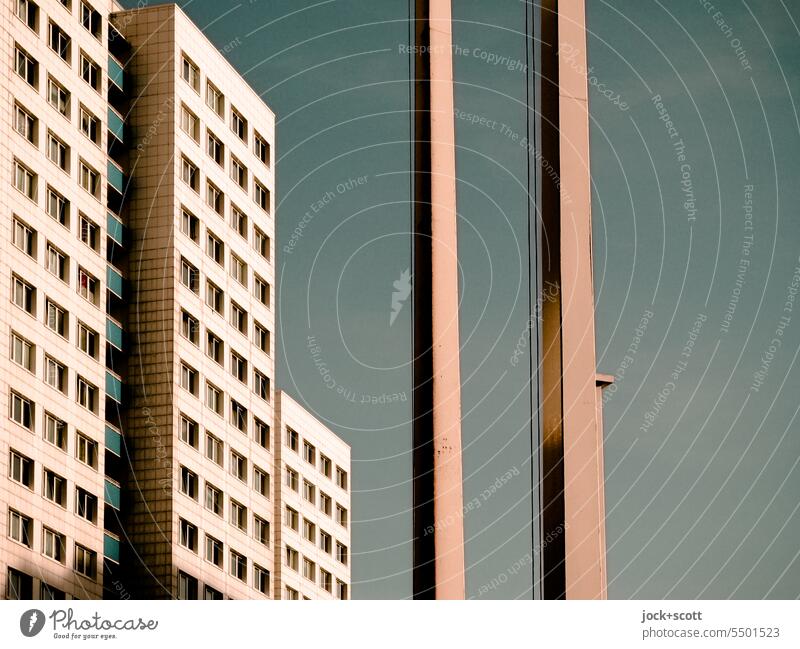 Large settlement with flagpoles Facade Prefab construction Architecture Socialism High-rise Detail GDR GDR architecture Cloudless sky Style Parallel Symmetry