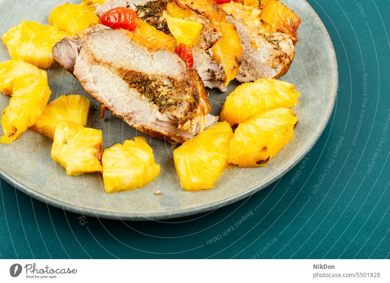 Delicious meat baked with pineapple. roasted food pork pina dish cuisine dinner plate fruit portion steak chop fried prepared hot juicy sweet american slice