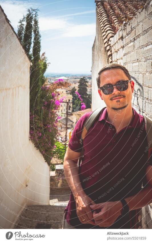 Middle-aged man with sunglasses and wine red polo shirt leaning against a wall in Granada, Andalusia Spain Andalucia Summer ardor middle-aged man Shadow Wait