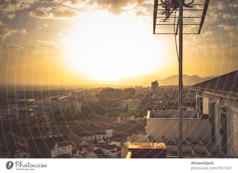 TV antenna and panoramic view over the historic city center of Granada in Andalusia at sunset Spain Andalucia Old town Panorama (View) Sunset Antenna
