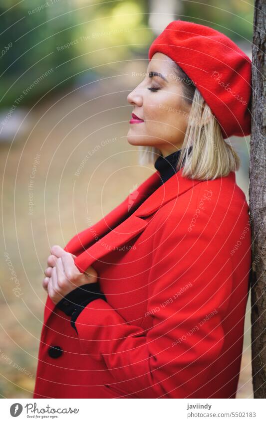Stylish woman near tree in autumn park street style feminine elegant leisure peaceful path fall pathway walkway outfit female town fashion red lady beret coat