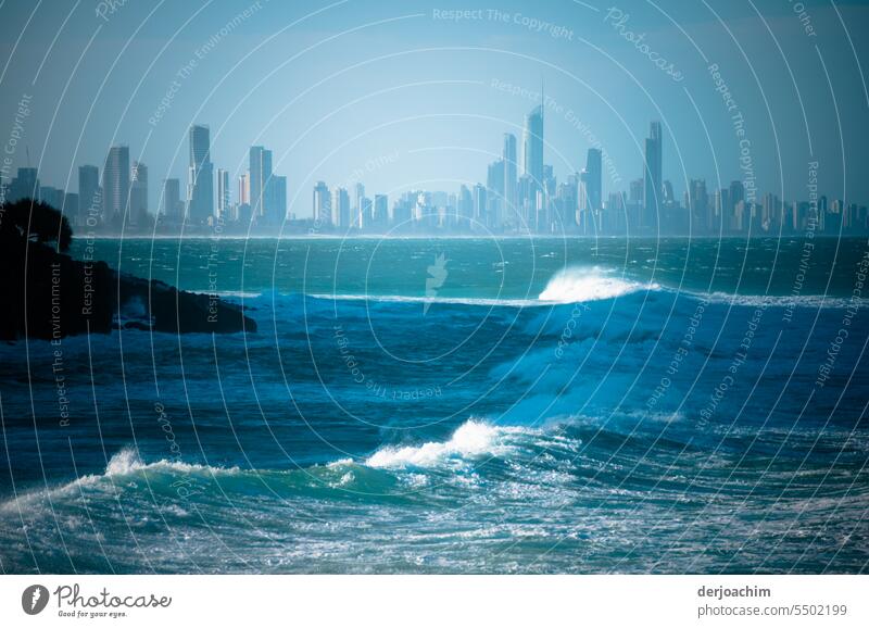 The waves of the Pacific in the foreground and the skyline of Surfers Paradise in the back. city by the sea coast Nature Sky Landscape Horizon Ocean Summer