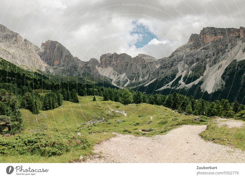 Mountain panorama, dry stream bed, hiking trail, rocks and boulder field, sky with clouds mountain Alps Peak Clouds Green Landscape South Tyrol Hiking