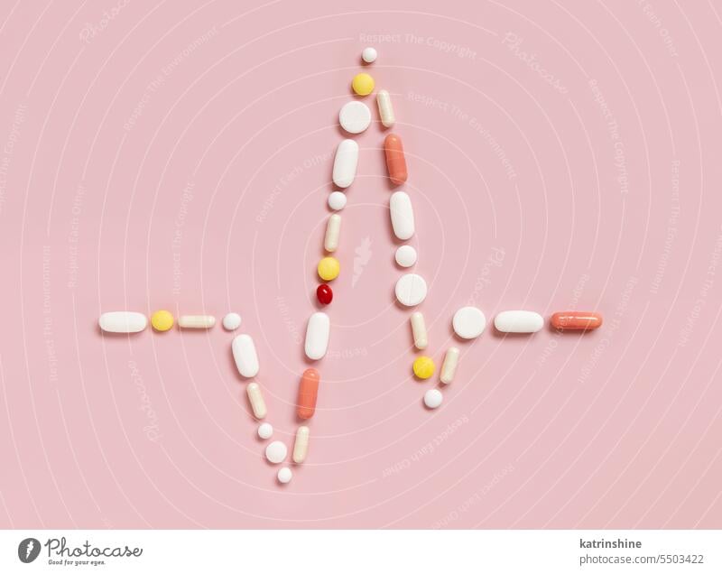 Heart rhythm cardiogram line made of colorful drug pills and capsules on light pink, top view Pharmaceutical cardiology treatment diseases medicine medical