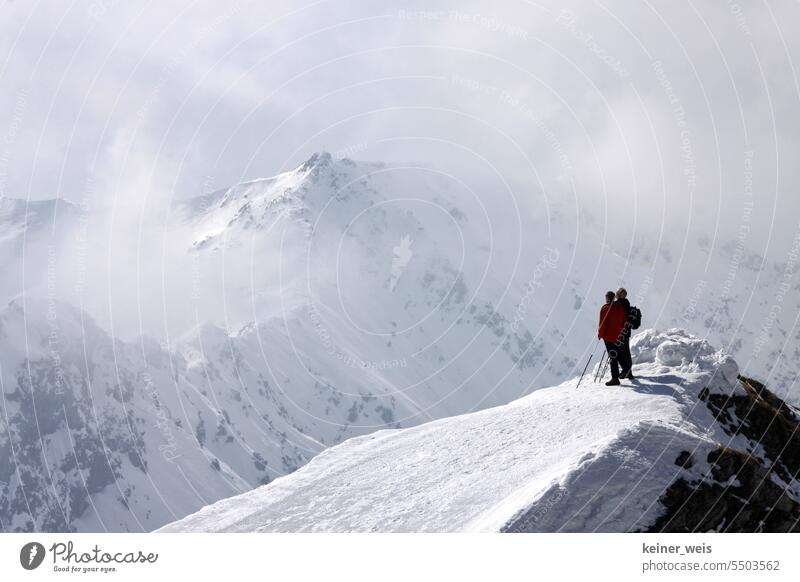 Two hikers summiting a peak of the Alps in the snow summit forward mountain Snow Peak Allgäu Anonymous Oberstdorf persons Landscape mountains Bavaria Germany