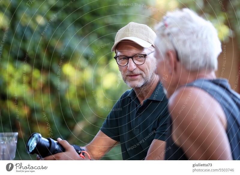 Drinkje bej Inkje | Two men engrossed in conversation, shop talk among photographers portrait man talk To talk Communicate argue camera Garden