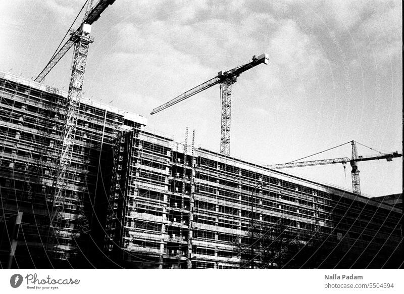 Cranes on construction site - lateral Analog Analogue photo B/W Black & white photo black-and-white Architecture Building Construction site Scaffolding