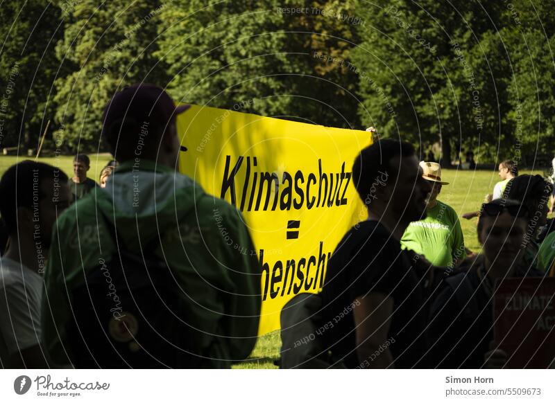 Banner calls for more climate protection at a demonstration Climate protection Flag banner symbol protest Actions youthful Environmental protection