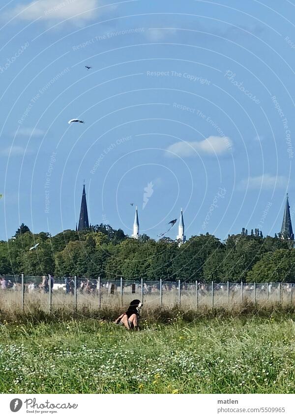 Master and dog in front of church and mosque steeple, minaret,church,mosque Meadow master Dog Sky over Berlin Exterior shot kites Fence dreams