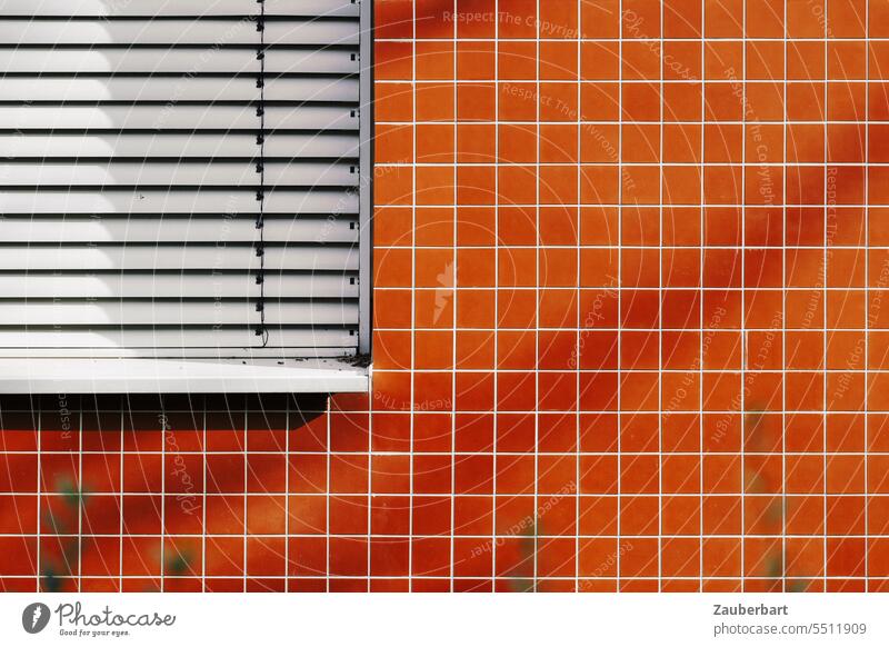 Facade with orange square tiles and closed blinds Orange Venetian blinds Minimalistic geometric shape structure Architecture Abstract Modern Pattern