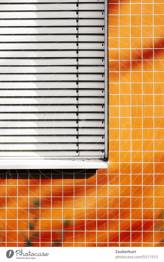 Facade with orange square tiles and closed blinds Orange Venetian blinds Minimalistic geometric shape structure Architecture Abstract Modern Pattern