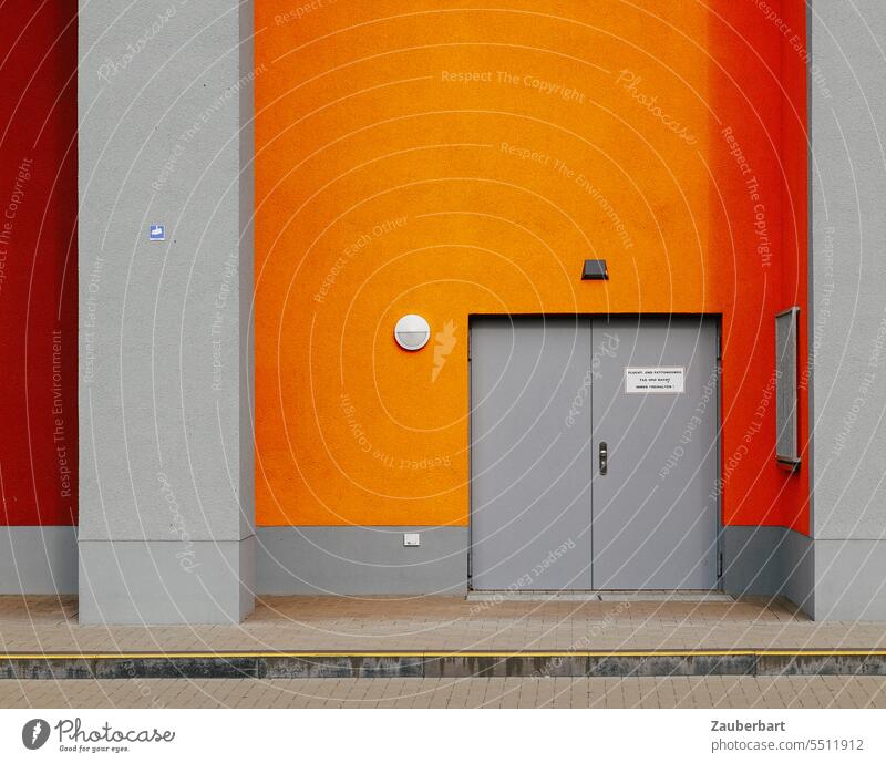 Facade in orange with gray door and gray pillars Orange Gray piers Minimalistic unostentatious Wall (building) Architecture Structures and shapes Building
