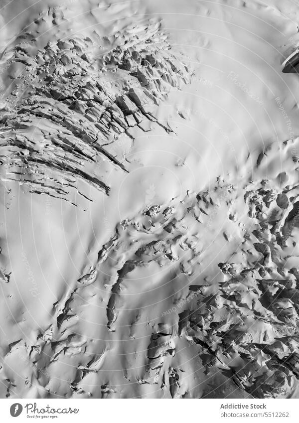Snow textured surface in wintertime mount snow nature highland landscape rough Zermatt ridge Switzerland scenic atmosphere uneven mountain geology cold weather