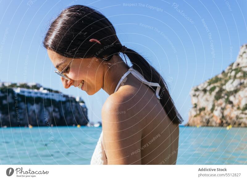 Young woman near sea in summer day travel tourist vacation trip nature ocean female glasses holiday water young tourism marine spain seascape summertime journey