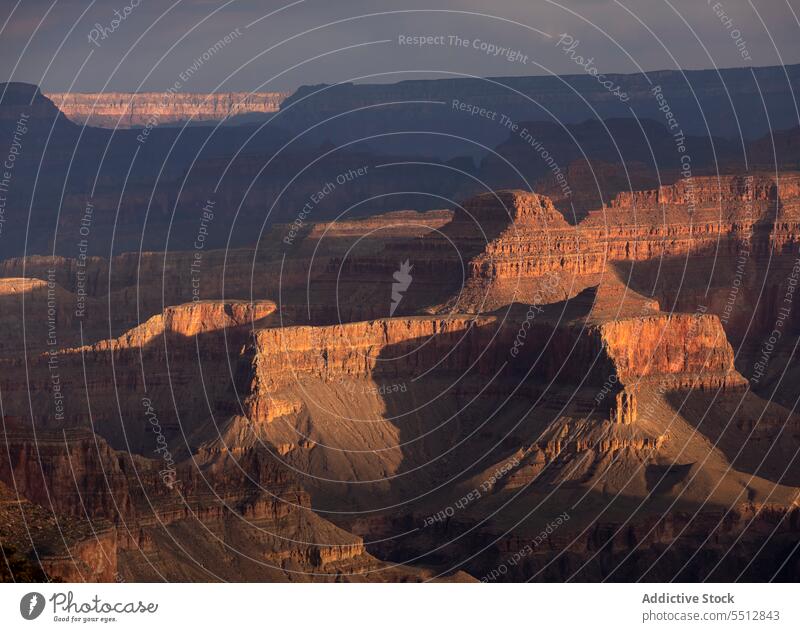 Rocky formation in evening time grand canyon rocky geology rough cloudy sightseeing stone national usa america united states arizona location massive ravine