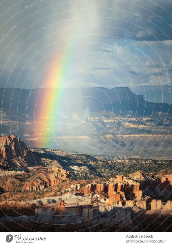 Rainbow above rocky rough terrain canyon rainbow overcast nature landscape scenic usa formation amazing scenery sky picturesque majestic geology environment