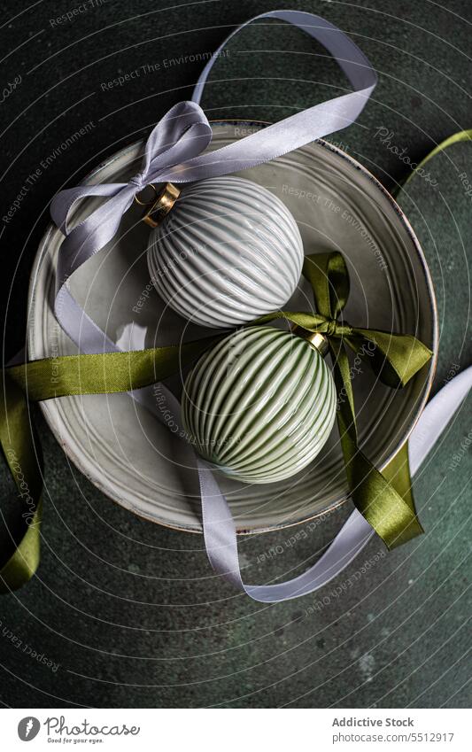 Christmas baubles on bowl grey christmas ribbon symbol tradition ball festive new year ceramic decoration holiday xmas celebrate decorate december element event