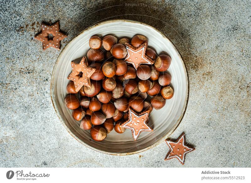 Plate of chestnuts with Christmas cookies christmas plate gingerbread dessert holiday food celebrate tasty xmas delicious yummy festive sweet pastry heap baked