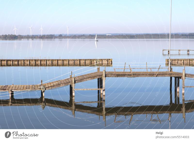 all over the place Lake Dümmer See Water Surface of water Footbridge wooden walkway jetty reflection Sailboat windmills Sky Beautiful weather tranquillity