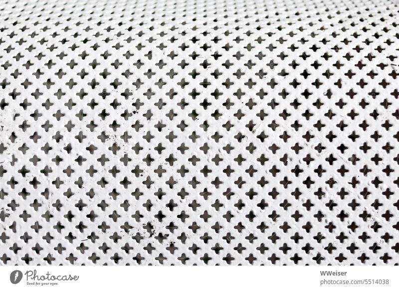 A curved white metal piece with punched out cross pattern Metal Pattern White background Abstract Structures and shapes Design Close-up Detail