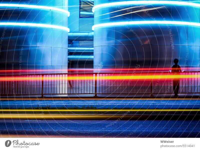 The fluorescent tubes on the tanks and the traces of cars and bus create a colorful striped pattern Light Strip of light Movement pass Tank Industry Street