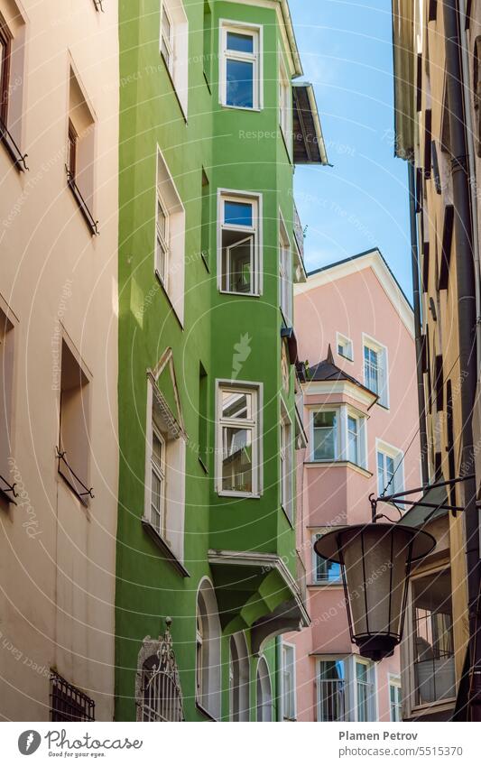 Facades of the historic old town of Innsbruck, Austria. background sky travel house city landscape building wall green architecture blue color window street