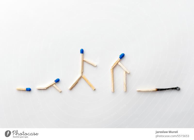 Concept photo showing the idea of human life cycle metaphor conceptual photography no people indoors white background Consistencies Straw burnt match Blue lace