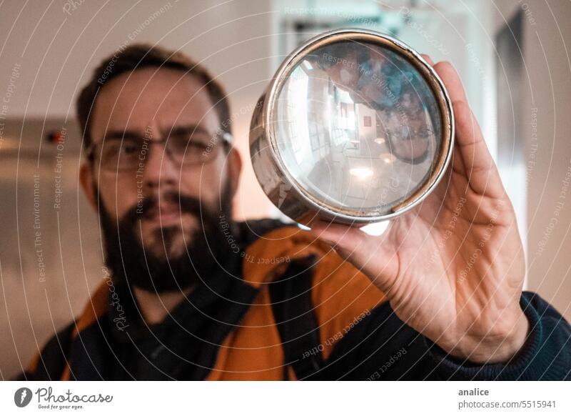 Man looking through magnifying glass glasses Magnifying glass lenses looking through glass holding observing beard explore explorer Analyzing Eyes Wink enlarge
