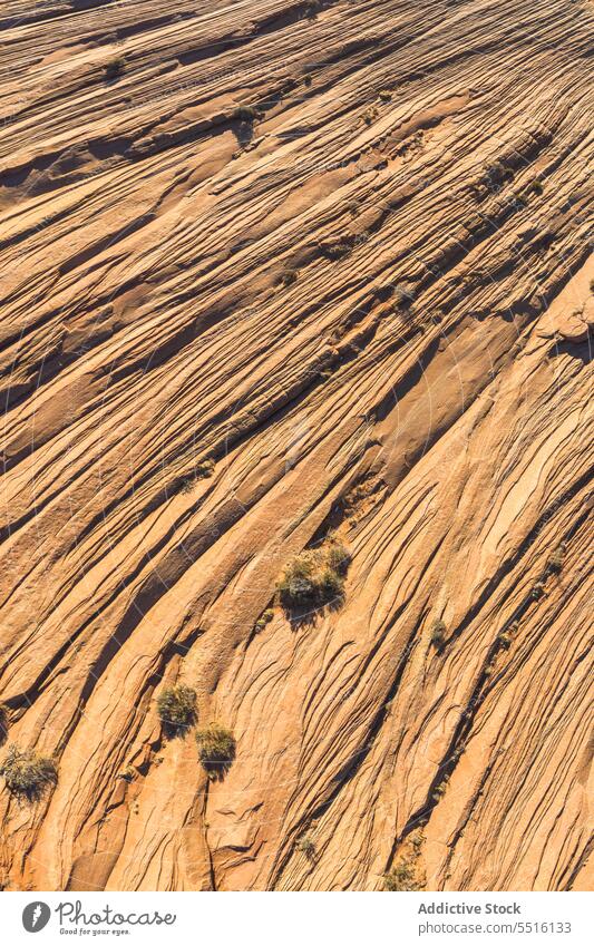 Abstract background of rocky formation with uneven texture cliff abstract surface rough crack geology sandstone mineral material solid structure line scratch