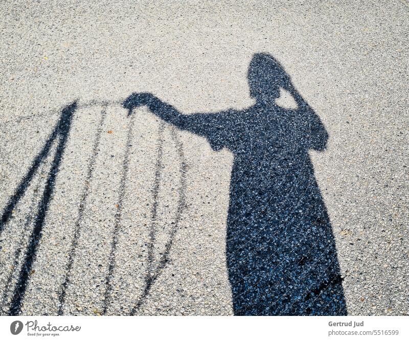 Shadow selfie on fence Light Visual spectacle Shaft of light Shadow play Shadow image shadow cast shadow pictures Shadow child Fence Sunlight sunny