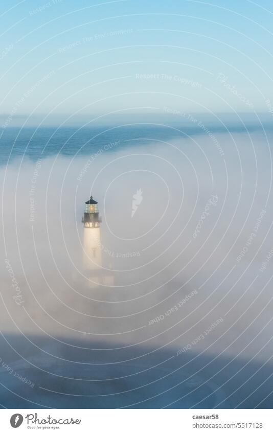 Scenic lighthouse in the early morning, Yaquina head in Oregon oregon fog coast ocean nature historic pacific sea water mist grass landscape old beacon typic