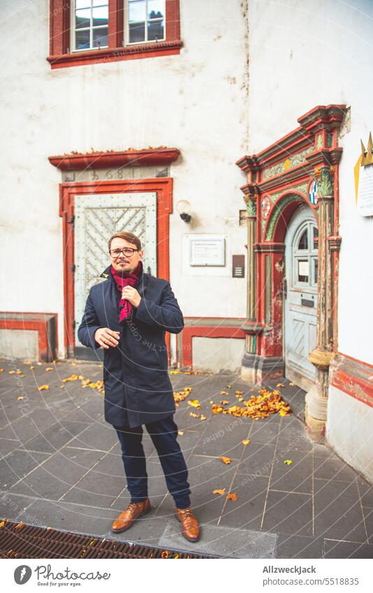 Middle-aged man in autumn clothes in front of historical house in Koblenz, Germany Autumn Autumnal germany trip home leave Man middle-aged man Congenial Coat