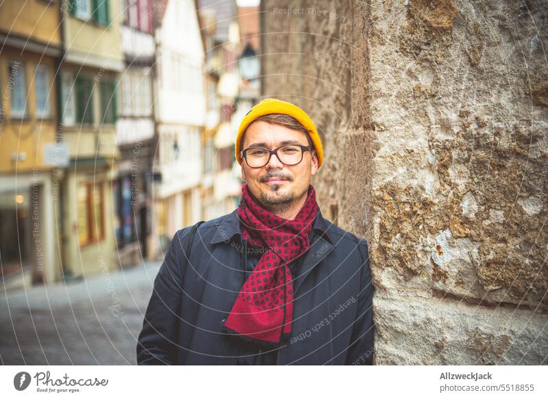 Middle-aged man in autumn clothes in front of sandstone wall Autumn Autumnal germany trip home leave Man middle-aged man Congenial Coat chill Scarf smart