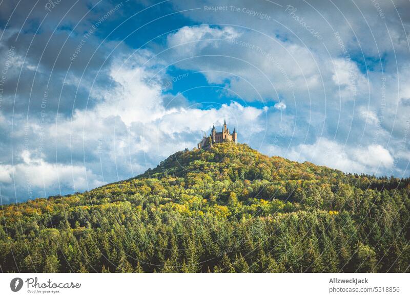 Hohenzollern castle with forest area and blue but cloudy sky Germany Castle Castle Hohenzollern Forest woodland Aristocracy Beautiful weather Clouds Landscape