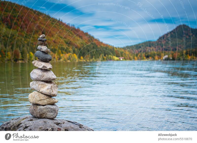 Stone tower on the shore of a mountain lake Nature Lake Lakeside Water Mountain stones stone tower Stones on the beach Tower balance Balanced attentiveness