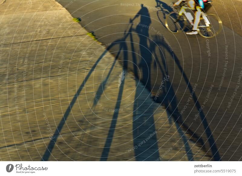 Shadow on asphalt (bicycle) Evening Berlin Twilight Bicycle Closing time Far-off places Trajectory Airport Airfield Freedom Spring Sky Light Deserted Wheel