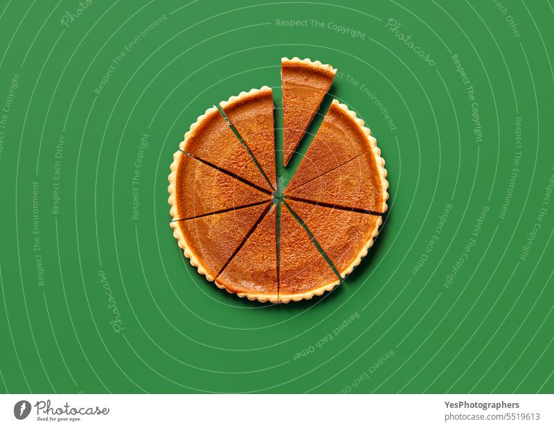 Sliced pumpkin pie, top view on a green table Halloween above autumn background baking bright brown cake celebration christmas color comfort concept context