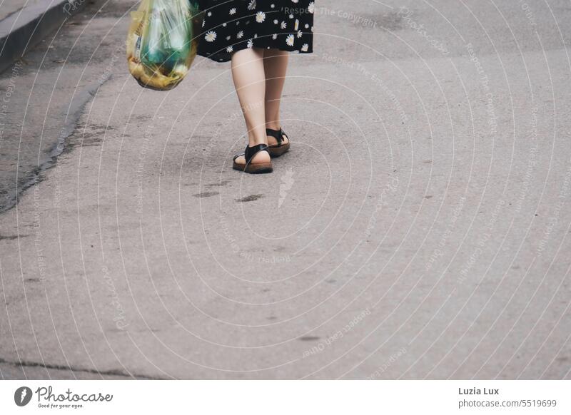 Woman wears black and white patterned skirt, she has been shopping and carries a full bag Legs Women's legs feminine Femininity Skirt purchasing shopping bag