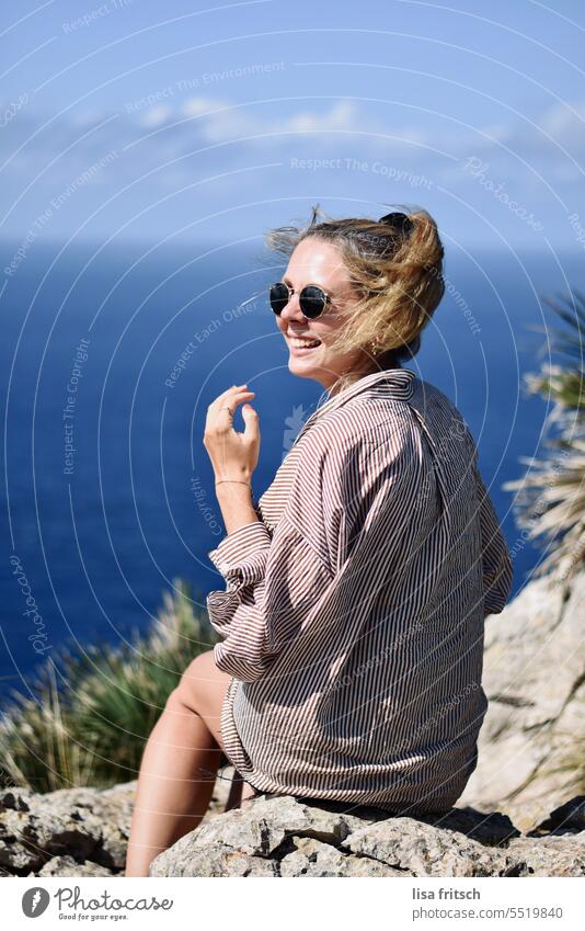 HAPPY - SUMMER VACATION Woman fortunate Sunglasses youthful 25 to 30 years Ponytail Laughter joyfully sedentary Ocean enjoying the view Summer Vacation & Travel
