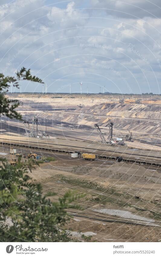 Garzweiler opencast lignite mine with excavators and foresight of wind turbines Open pit mine Coal Lignite Soft coal mining Soft coal dredger Environment