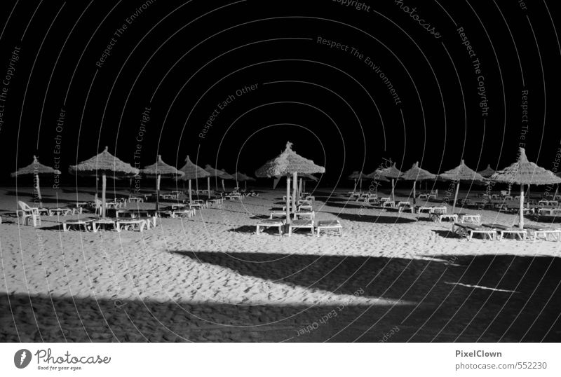 Shady sides of beach life Vacation & Travel Tourism Summer Beach Ocean Night life Swimming & Bathing Sand Athletic Black White Loneliness Relaxation Contentment