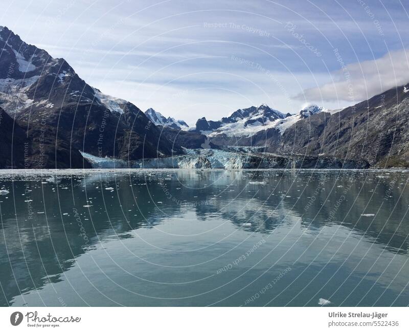 Alaska | Glacier Bay | a glacier flows directly into the sea Flow Ice Blue Cold Frost Water Ocean Termination break-off edge mountains snow-covered