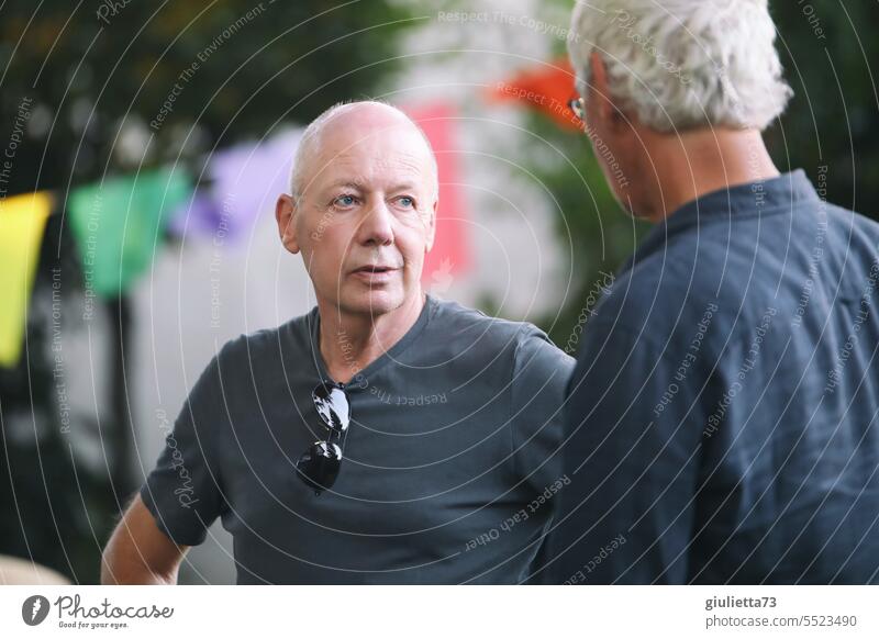 Drinkje bej Inkje | Men's talk, friendly exchange between two men during a garden party portrait more adult people masculine Gray-haired Outdoors conversation