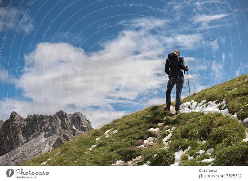 A hiker in the Alps Tourism Vacation & Travel Mountain vacation Hiking hikers path Clouds Landscape mountain Peak mountains Sky Rock Environment Day Nature