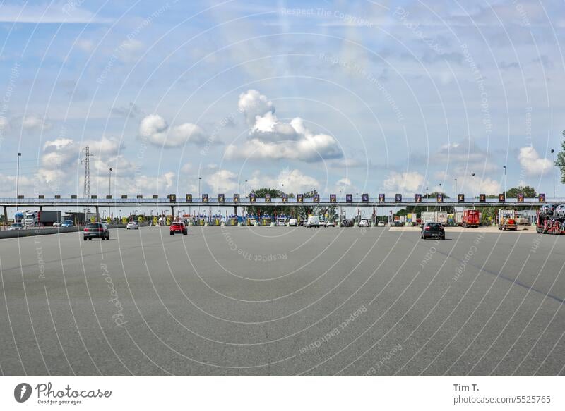 Border crossing point Europe France Street Highway toll Traffic infrastructure Sky Clouds Transport Colour photo Road traffic Exterior shot Motoring Driving