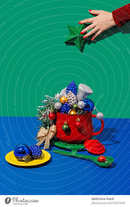 Christmas table setting with pot and ornaments christmas concept conceptual artistic creative modern decor colorful visual prepare cook cooking cooking pot