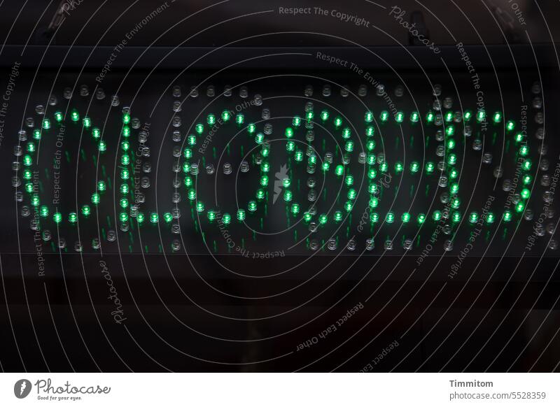 Again and again | CLOSED closed Clue Information Green LED Characters Signs and labeling Deserted Letters (alphabet) Background dark