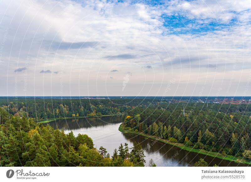 Bird's-Eye View of Neman River in Autumn Setting. Nemunas river in Druskininkai, Lithuania aerial view drone autumn fall foliage forest trees landscape nature