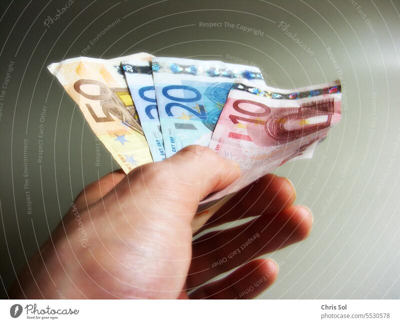 100 Euro money bills 50 €, 20 € ,10 € - cash money bills fanned out in one hand 100€ Bank note Money Loose change Take money give money salary wages 50€ 20€ 10€