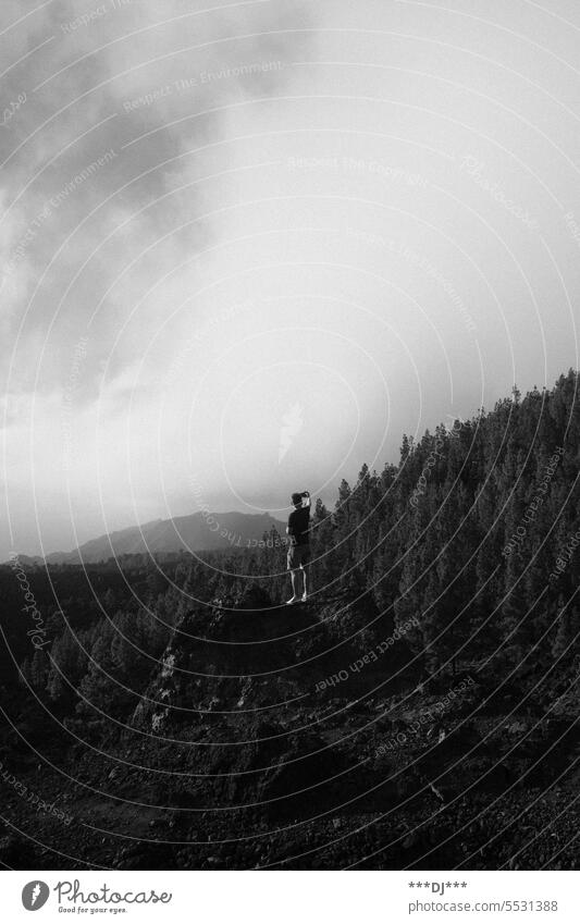 Selfie on a mountain Sky trees Forest Man Tourist Mystic Clouds Moody voyage voyager outlook Vantage point Monochrome silent Nature Landscape Exterior shot Calm